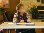 Lynn Holmes discussing some new postal programs in Oct.